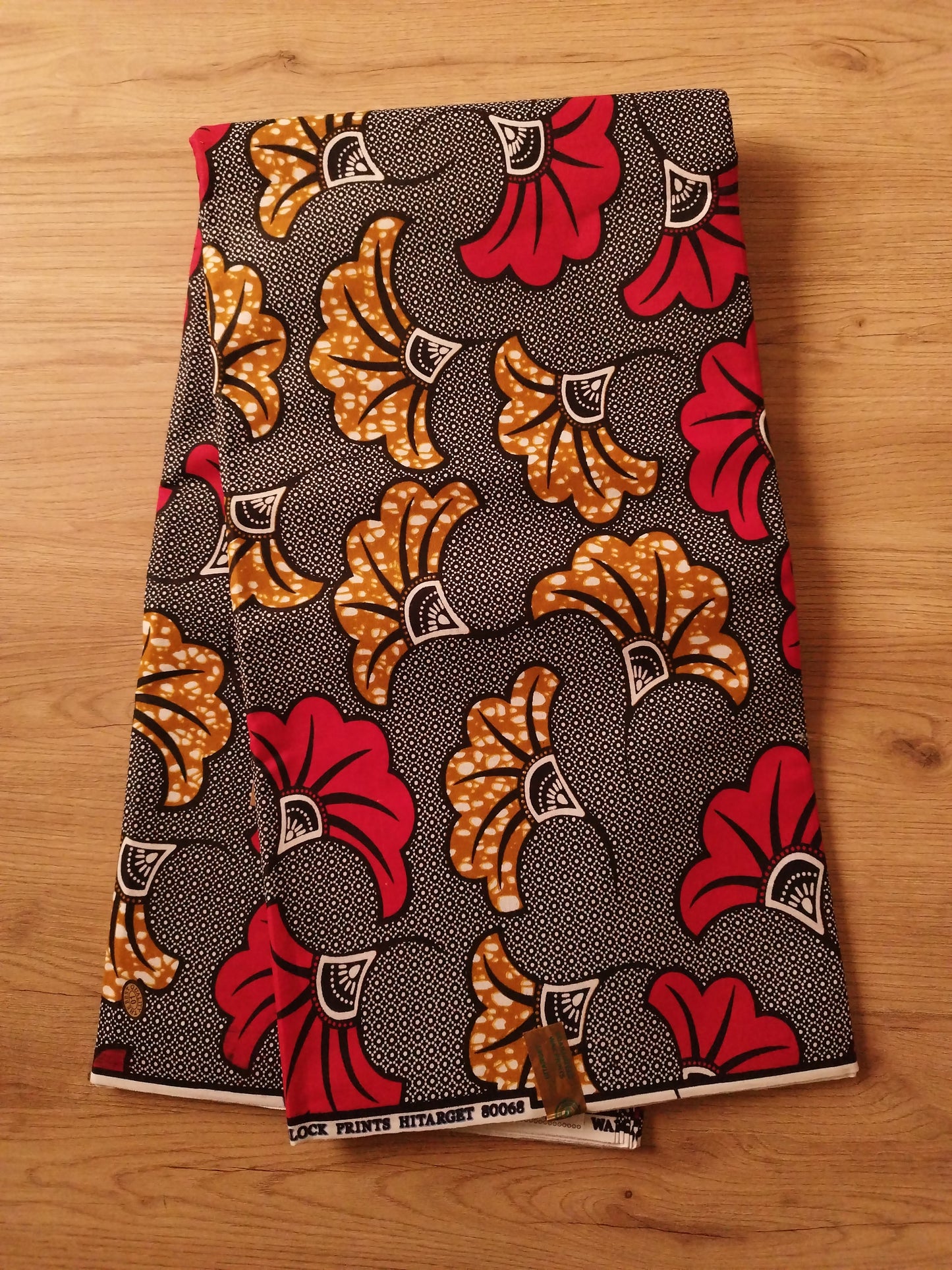 1 yard (90 cm) - Tissu wax fleurs de mariage rouges et oranges fond bleu marine