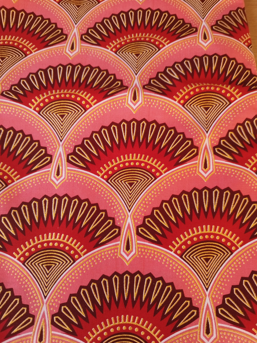Tissu wax pailleté - éventails rose corail - par 50 centimètres