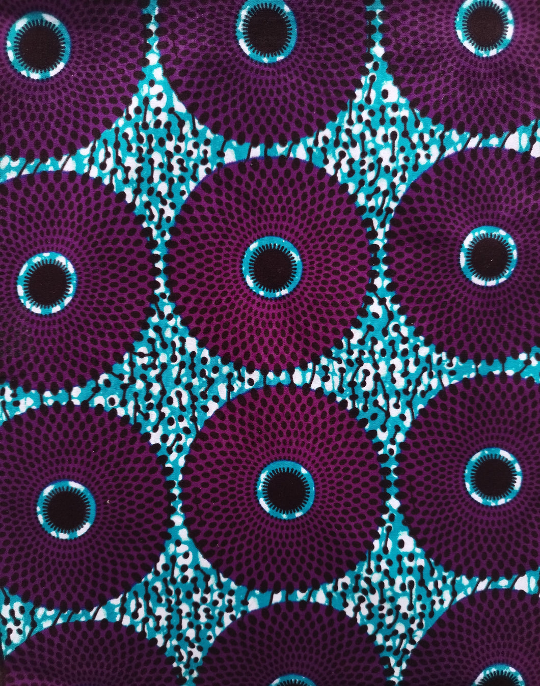 Tissu wax - petits disques violets fond bleu - par 50 centimètres