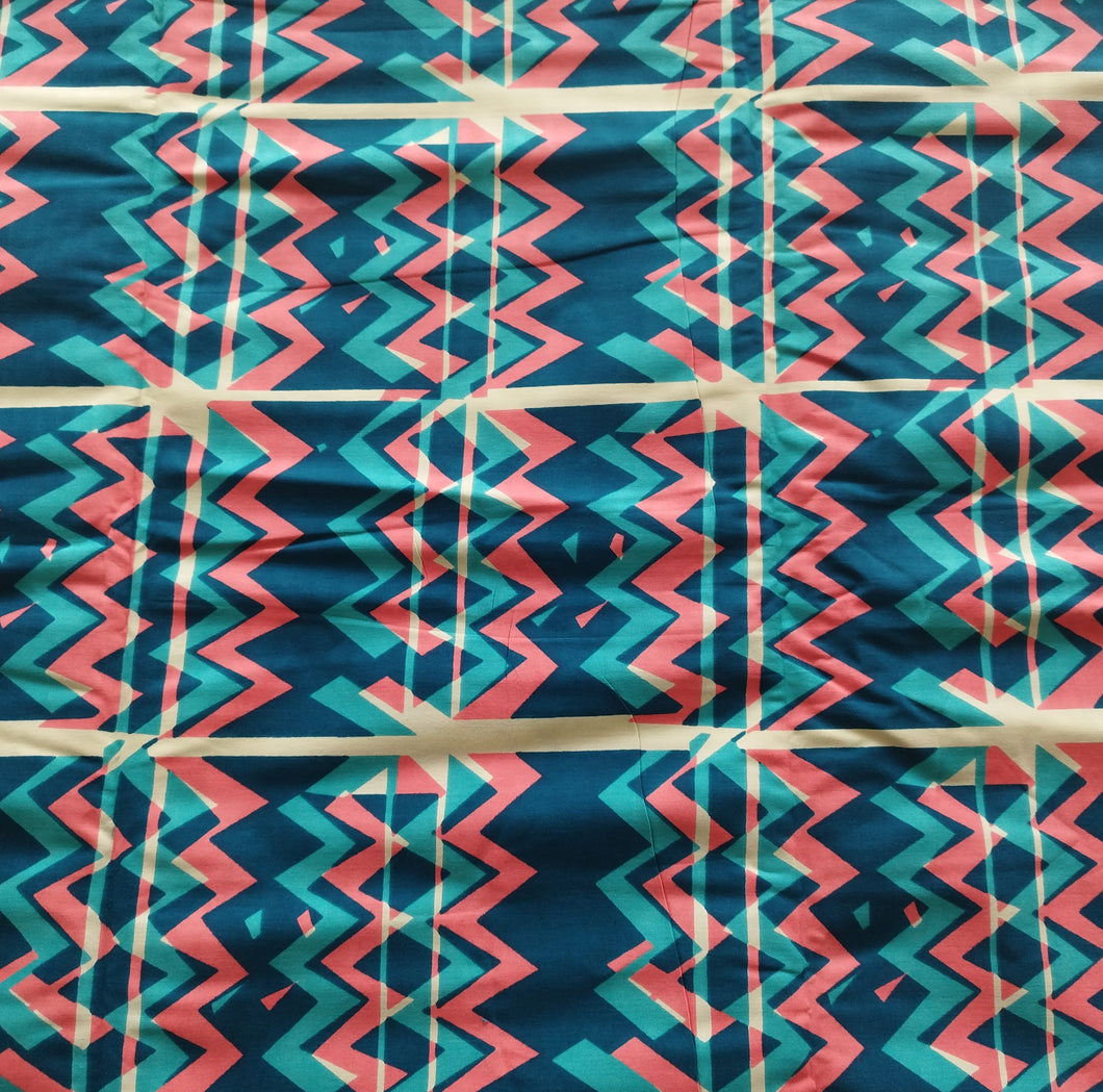 Tissu wax - motif ethnique corail et turquoise - par 50 centimètres