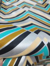 Charger l&#39;image dans la galerie, Tissu wax java - motifs linéaires bleus, noirs, kakis, beiges et argents - à partir de 50 centimètres
