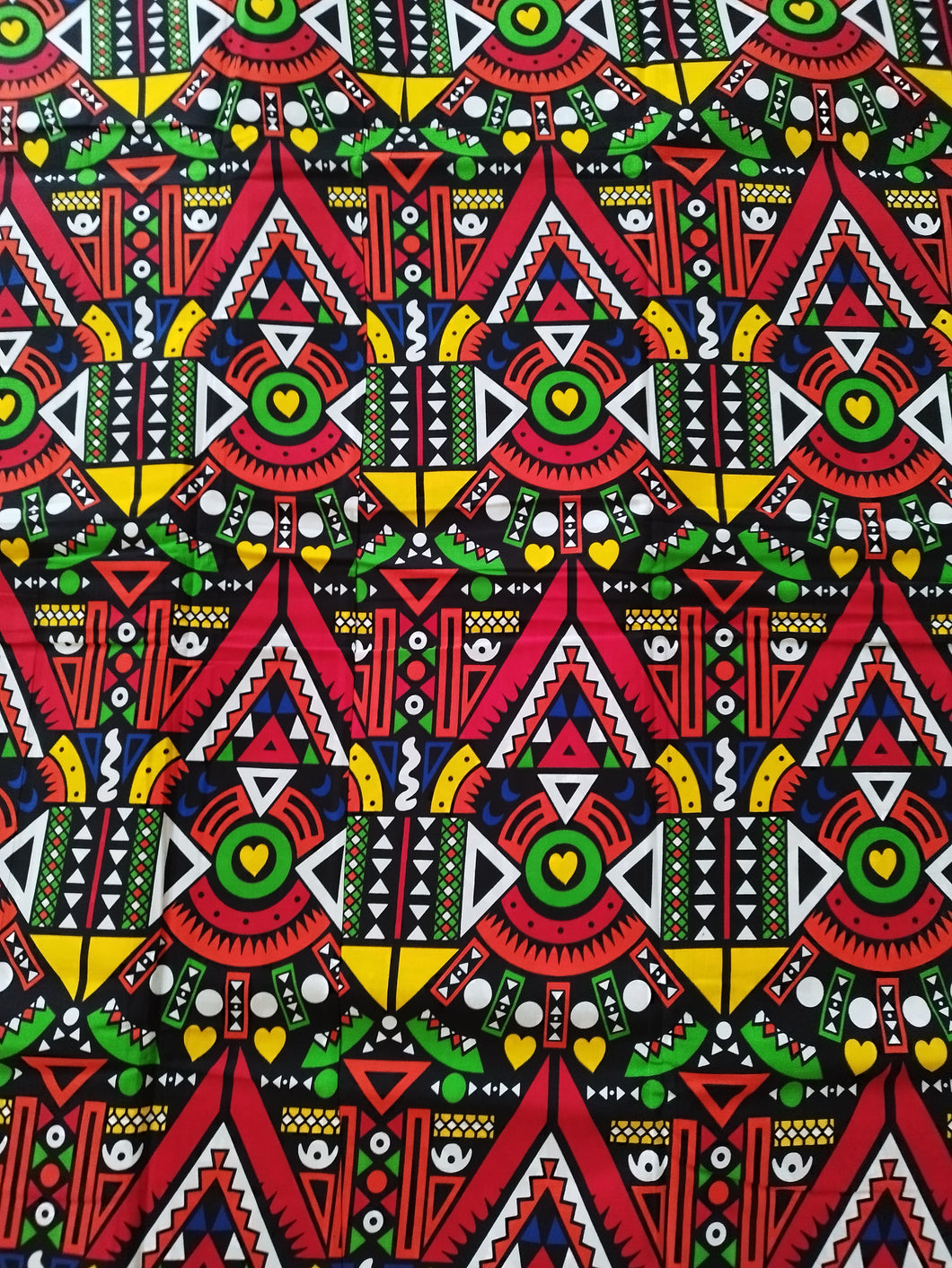 Tissu wax - motif graphique multicolore à dominante orange - par 50 centimètres