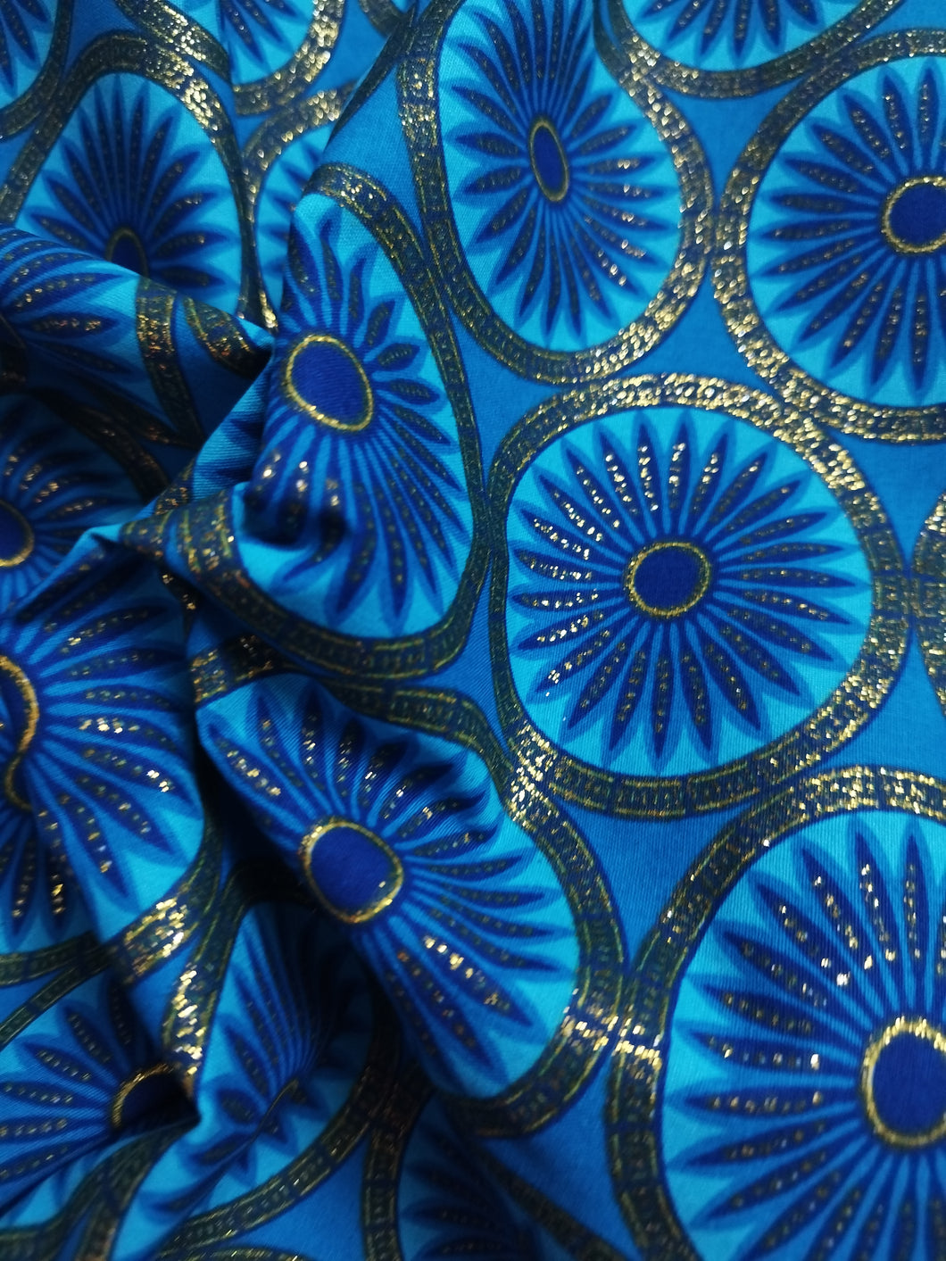 Tissu wax pailleté - rosaces bleues et détails dorés - par 50 centimètres
