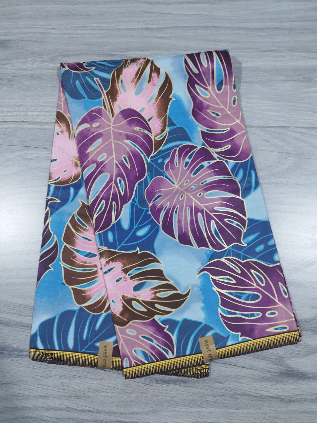 Tissu wax java gold - grandes feuilles violettes et bleues - par 50 centimètres