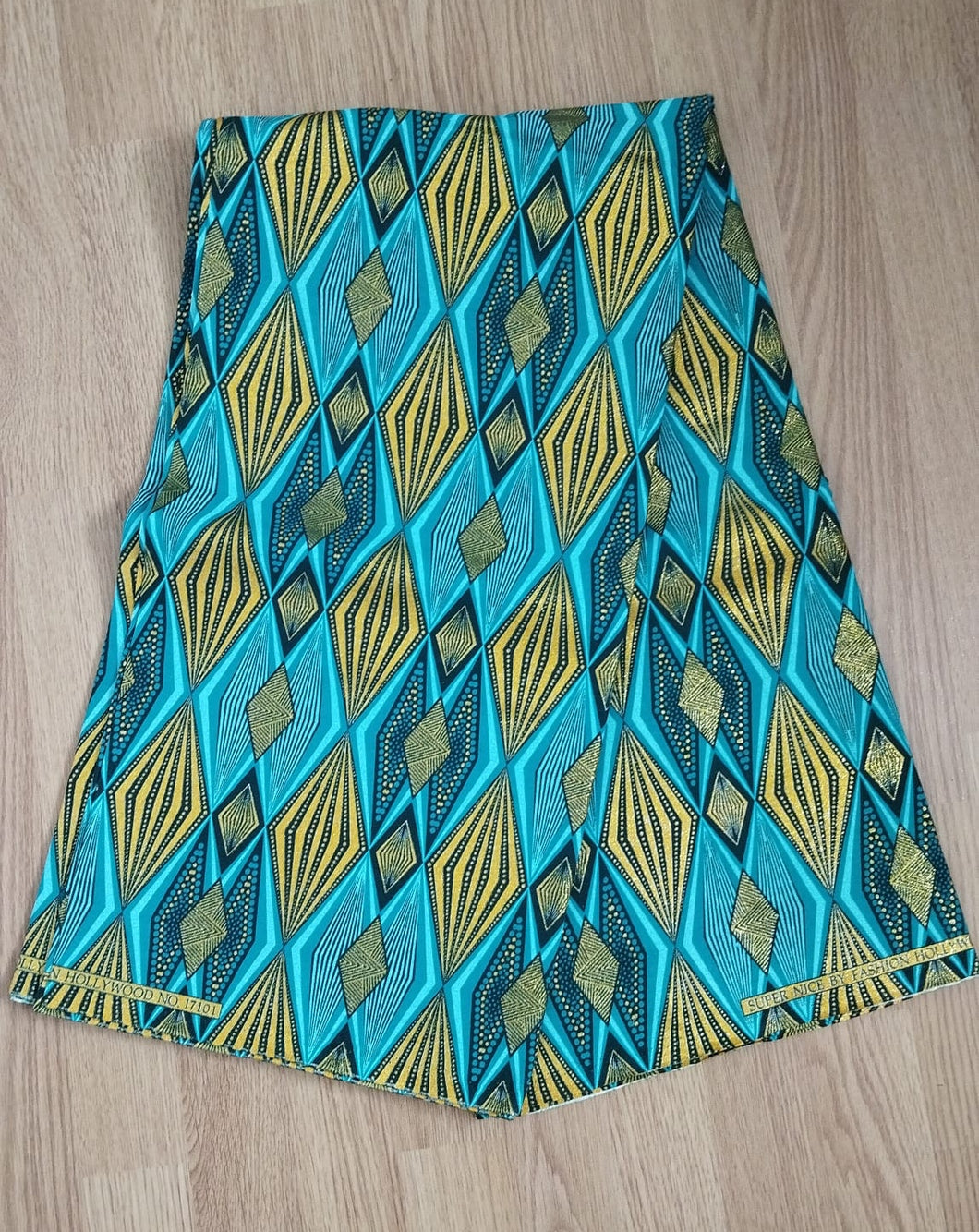 Tissu wax pailleté - losanges turquoises et dorés - par 50 centimètres