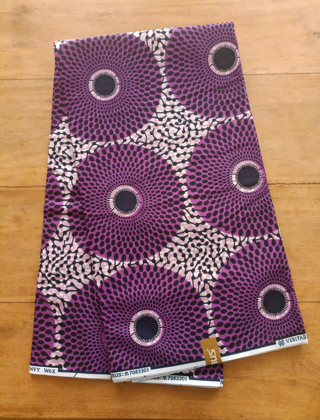 Tissu wax - grands disques violets - par 50 centimètres